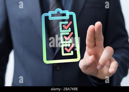 Touching Check List on Visual Screen Stock Photo