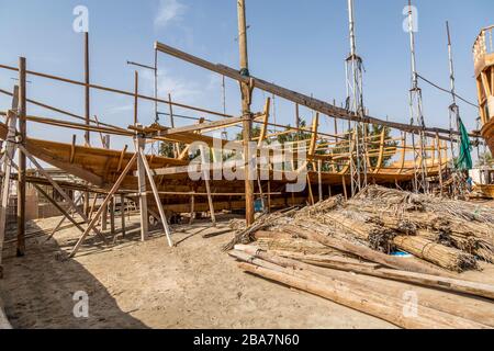 A traditional Dhow boat building yard in the city of Sur, Oman. The last remaining such yard in Oman. Stock Photo