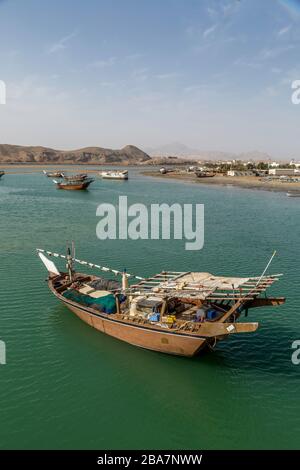 The city of Sur, Oman. Showing traditional boats moored up in the coastal waters of the Gulf Of Oman. Stock Photo