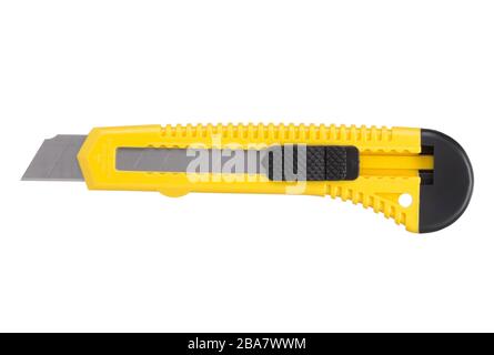 Yellow stationery knife with a blade isolated on a white background Stock Photo