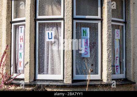 Westcliff on Sea, Essex, UK. 26th March, 2020. A house in a street near to Southend Hospital is displaying a message in the window thanking National Health Service staff. The road is frequently used by ambulances from the NHS hospital Stock Photo
