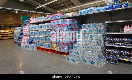 Stocks of drinking water on shelves in Morrisons supermarket in Colindale, London, United Kingdom Stock Photo