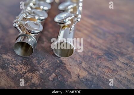 10 Close up of silver alto flute on a hardwood background Stock Photo