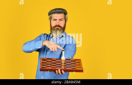Intelligence level measurement. level up your iq. bearded man hold chess board. intelligence quotient concept. human brain working. brainstorming concept. play chess tournament. copy space. Stock Photo