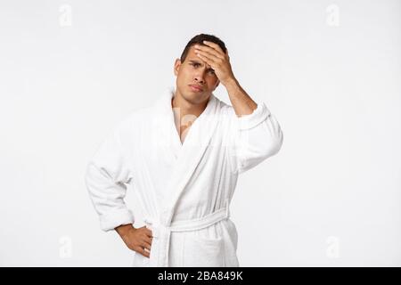 Puzzled African American man trying to remember important information, pensive thoughtful young male Stock Photo