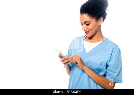 African american nurse using smartphone isolated on white Stock Photo