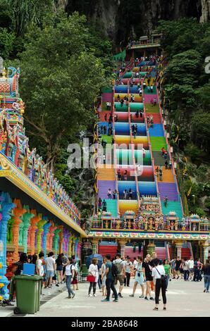 Batu Caves, Malaysia - 7 September, 2018: New iconic look with colorful stair and unidentified visitors at Murugan Temple Batu Caves, Malaysia. - The Stock Photo