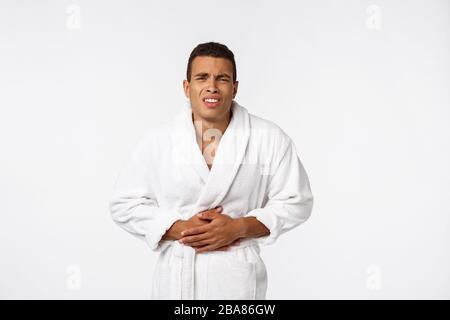 Puzzled African American man trying to remember important information, pensive thoughtful young male Stock Photo