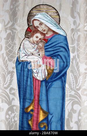 Madonna and Child Wall Hanging in the Priory and Parish Church of Saint Mary in Beddgelert, Gwynedd, Wales Stock Photo