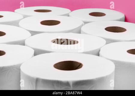 Toilet paper rolls isolated on pink background Stock Photo