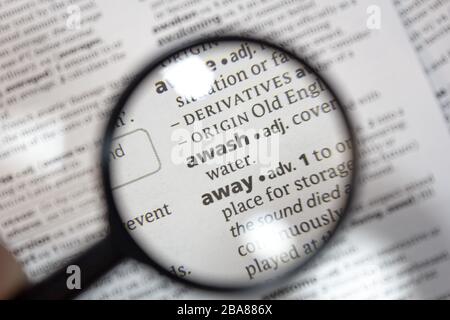 The word of phrase awash in a dictionary Stock Photo - Alamy