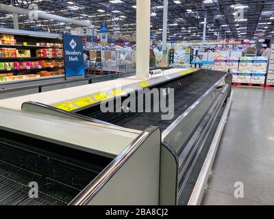 Orlando,FL/USA-3/17/20: Empty refridgerator cases at a Sams Club where customers have purchased all of products due to panic over the coronavirus covi Stock Photo