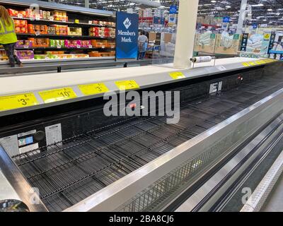 Orlando,FL/USA-3/17/20: Empty refridgerator cases at a Sams Club where customers have purchased all of products due to panic over the coronavirus covi Stock Photo