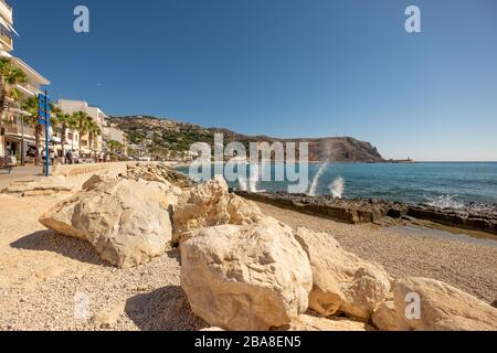 Large rock boulders on the beach front at Xabia Javea Costa Blanca Spain Stock Photo