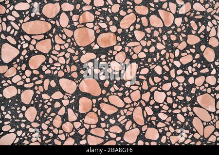 Closeup view at stone wall with geometric patterns Stock Photo