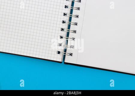 Notebook isolated on blue background Stock Photo
