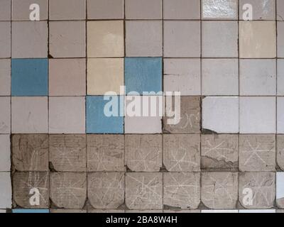 Old tiles and textures on decaying house wall Stock Photo