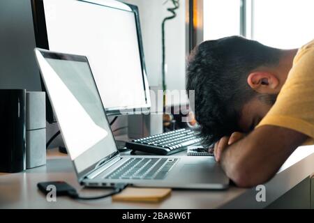 Tired of working from home at your desk with computers Stock Photo
