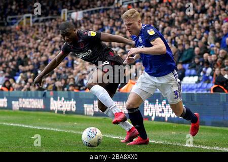 Reading's Yakou Meite battle for the ball with Birmingham City's Kristian Pedersen Stock Photo