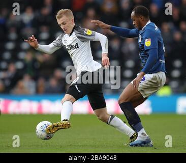 Derby County's Louie Sibley and Blackburn Rovers' Ryan Nyambe (right) battle for the ball Stock Photo