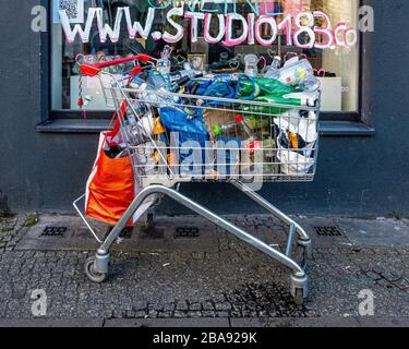 Supermarket trolley containing bottles for recycling , Mitte, Berlin Stock Photo