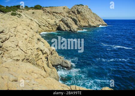 view over cliffs and wild coastline in Cala Gat near Cala Rajada, Mallorca, Spain Stock Photo
