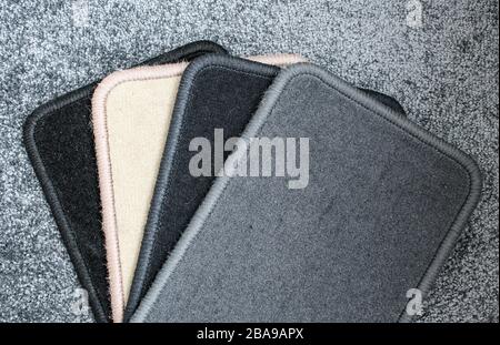 Samples of carpet with overlock. Finishing coatings for the floor. Stock Photo