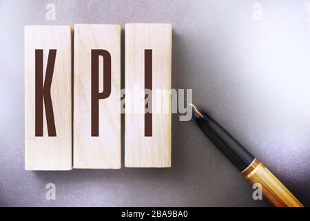 KPI Key Performance Indicator written on a wooden blocks. Business concept Stock Photo