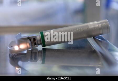 Laryngoscope for tracheal intubation on table in ICU in hospital. Intubation of  covid patients is very risky for medical staff. Stock Photo