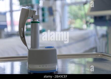 Laryngoscope for tracheal intubation on charge station in ICU in hospital. Intubation of  covid patients is very risky for medical staff. Stock Photo