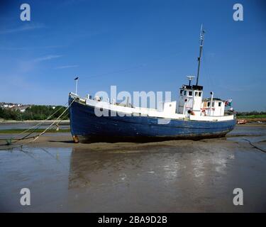 Boat at low tide, Barry Island, Vale of Glamorgan, South Wales. Stock Photo