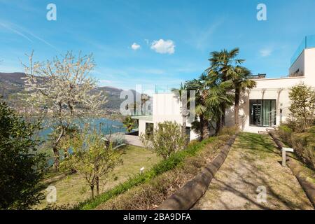 Architecture, view of a white modern house from the garden Stock Photo