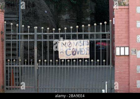 Paignton, Devon, England: Signs around the town warning of the Coronavirus danger, to keep a safe social distance and rainbows in support of the NHS Stock Photo