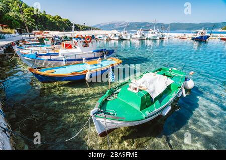 Colorful Greek local fishing boats in small port harbor of Kioni on Ithaka island, Greece. Stock Photo