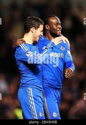 Chelsea's Eden Hazard (left) celebrates with his team-mate Victor Moses (right) after scoring his team's seventh goal Stock Photo