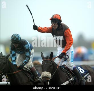 Jockey Sam Waley-Cohen celebrates after he wins the William Hill King George VI Chase with Long Run ahead of Captain Chris ridden by jockey Richard Johnson Stock Photo