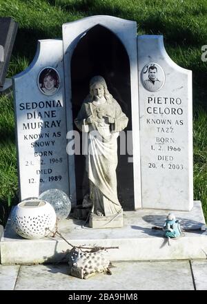 Jesus figure on grave in Camberwell New Cemetary, East Dulwich, South London Stock Photo