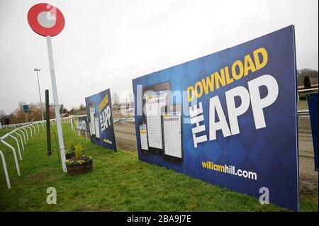 Detail of William Hill signage and the finishing post at Kempton Park Racecourse Stock Photo