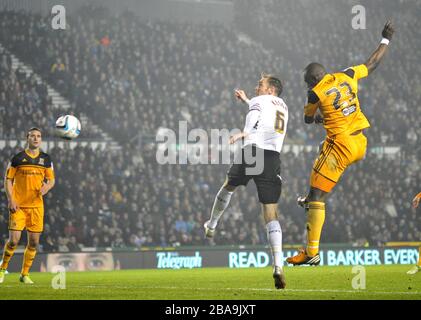 Hull City's Abdoulaye Faye out-jumps Derby County's Richard Keogh to score their winning goal Stock Photo