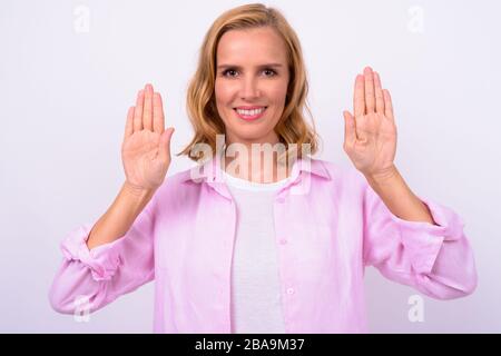 Portrait of happy beautiful blonde woman showing palm of hands Stock Photo