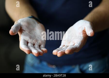 Male hands smeared with magnesium powder ready to workout Stock Photo