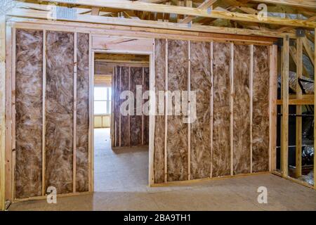 Thermal insulation a new house under construction on the roof in new home Stock Photo