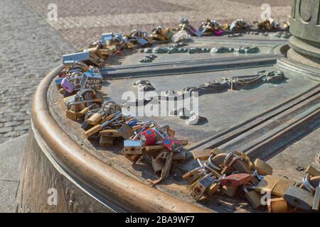 Plaza Mayor, Madrid, Spain; September 16 2018: Large number of locks of different shapes and colors closed between them Stock Photo