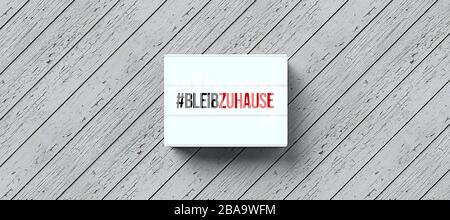lightbox with text STAY AT HOME in German on wooden background - 3D rendered illustration Stock Photo