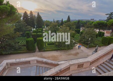 Palacio Real,Madrid,Spain;September 16 2018:Beautiful views of the royal gardens in the form of a labyrinth and with people walking and in the backgro Stock Photo