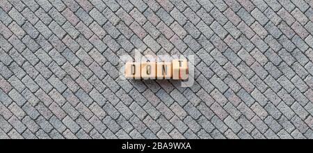 cubes with the words DON'T and DONE on pavement - 3D rendered illustration Stock Photo