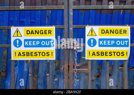 Danger Keep out Asbestos sign on gate Stock Photo