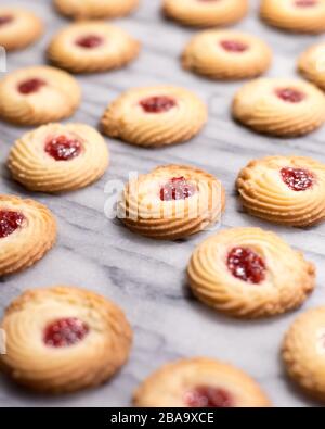 Raspberry Swirl Shortbread Cookies on a Marble Pastry Board Stock Photo