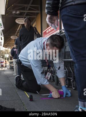 San Francisco, United States. 26th Mar, 2020. An employee of Mollie Stone's market measures out six foot spacing for customers waiting to enterb in San Francisco on Thursday, March 26, 2020. California is under a stay at home order except for essential needs such as grocery shopping. Photo by Terry Schmitt/UPI Credit: UPI/Alamy Live News Stock Photo