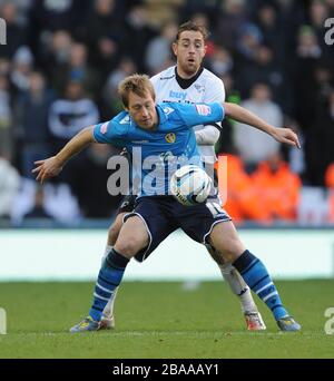 Derby County's Richard Keogh (back) and Leeds United's Luciano Becchio battle for the ball. Stock Photo